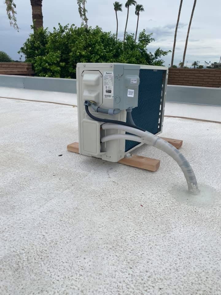 Outdoor mini split condenser on a rooftop